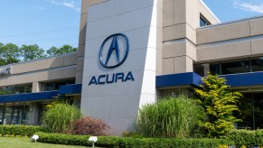 Acura company logo seen on one of their car dealerships