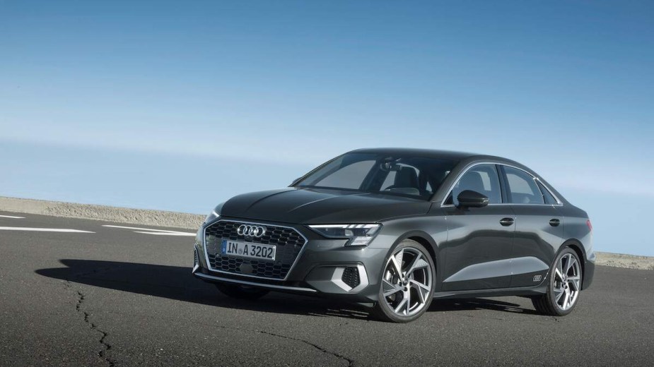 A silver Audi A8, which is one of Audi's best sedans, driving down a highway.