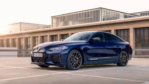 A BMW i4 M50 electric compact executive car model in Tanzanit Blue