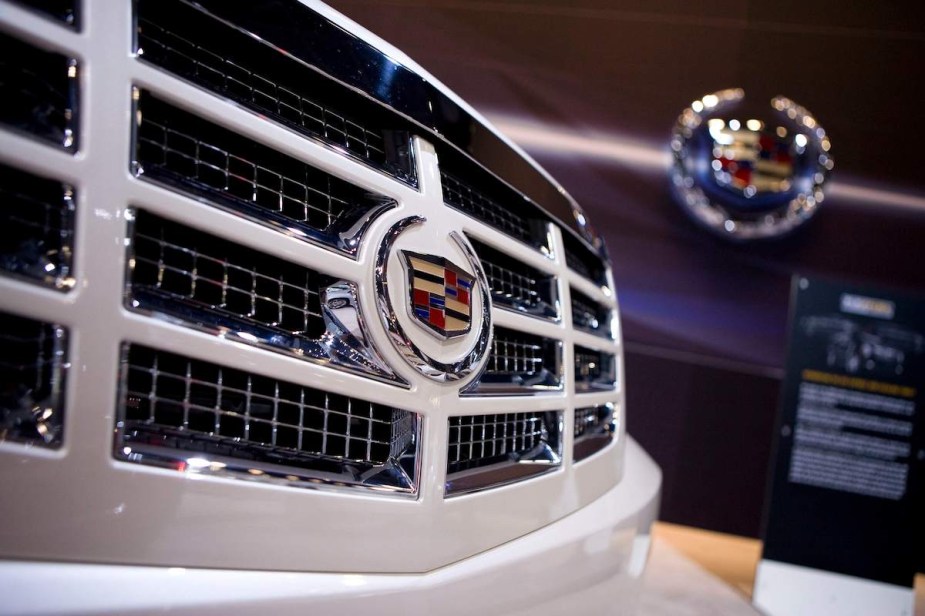 The frond of a Cadillac with the Cadillac logo displayed on the grille.