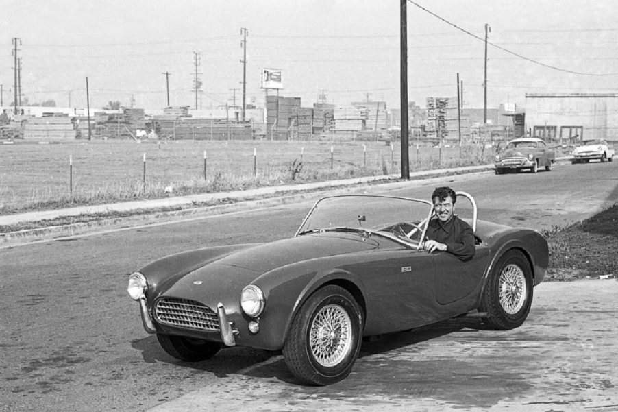 Carroll Shelby sits in a Cobra, a car that he turned into a Super Snake later in life.