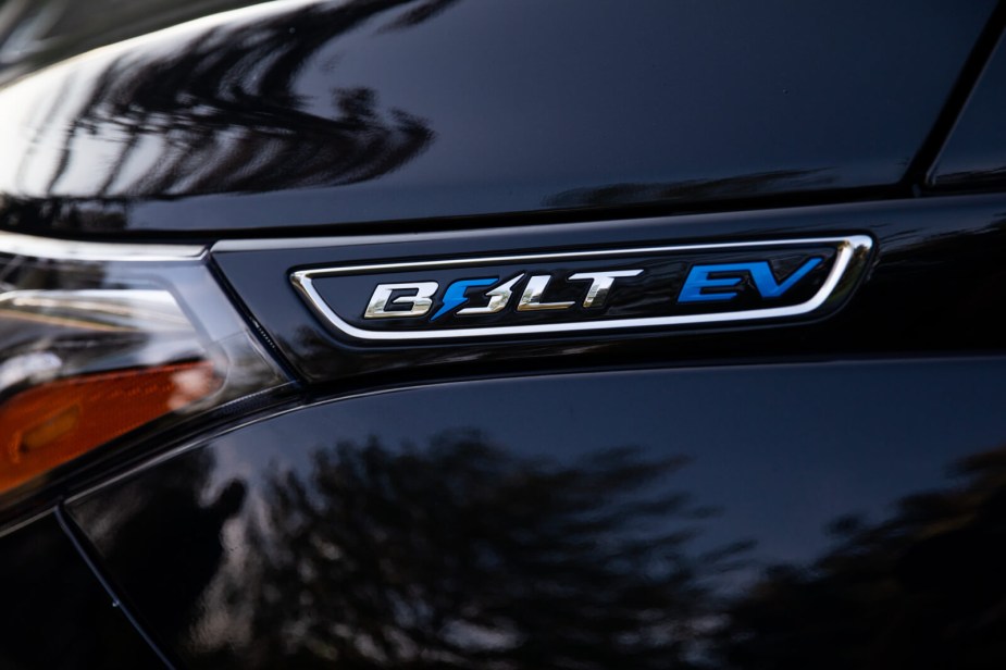 Close up of the badging on a black Chevy Bolt EV. 