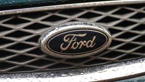 A Ford logo on the grille of an SUV.