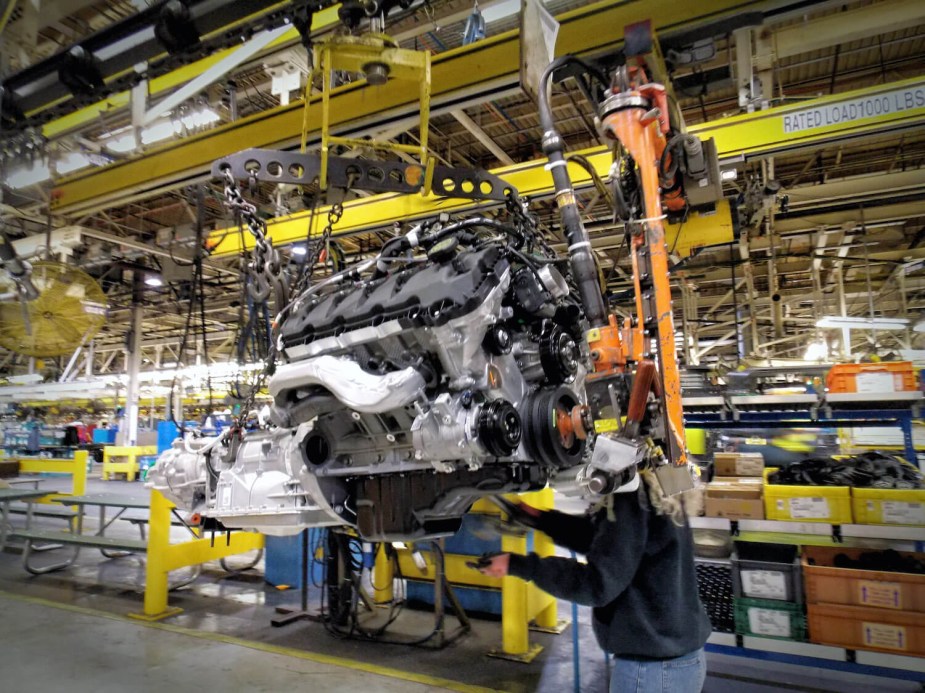 A Ford factory worker assembles a 5.0-liter F-150 V8, which is now made exclusively in Canada.