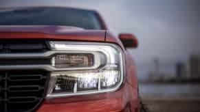 A red Ford Maverick headlight closeup, which is one of the best Ford vehicles.