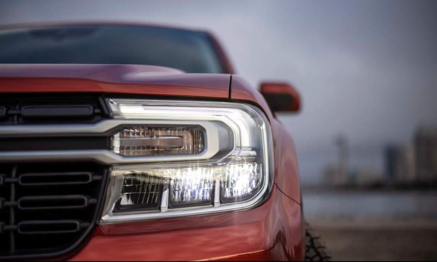 A red Ford Maverick headlight closeup, which is one of the best Ford vehicles.