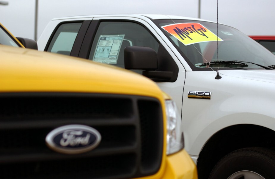 A Ford F-150 full-size truck sits on a dealership lot. A used Ford truck engine can be a risky gambit.