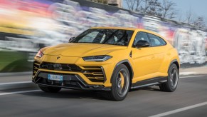 Front angle view of yellow 2023 Lamborghini Urus, cheapest new Lamborghini car in 2023 and one of fastest SUVs