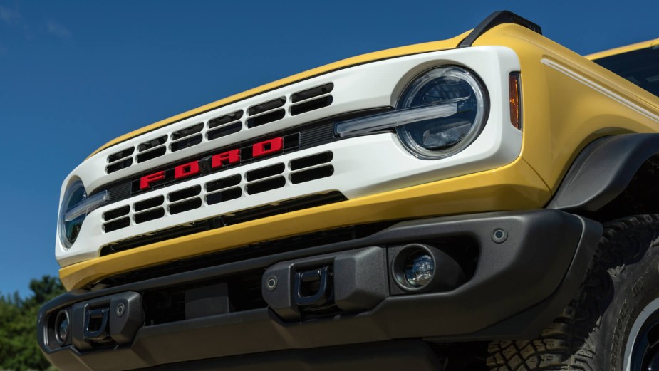 The front grille of a yellow 2023 Ford Bronco Heritage Edition Limited Edition. 