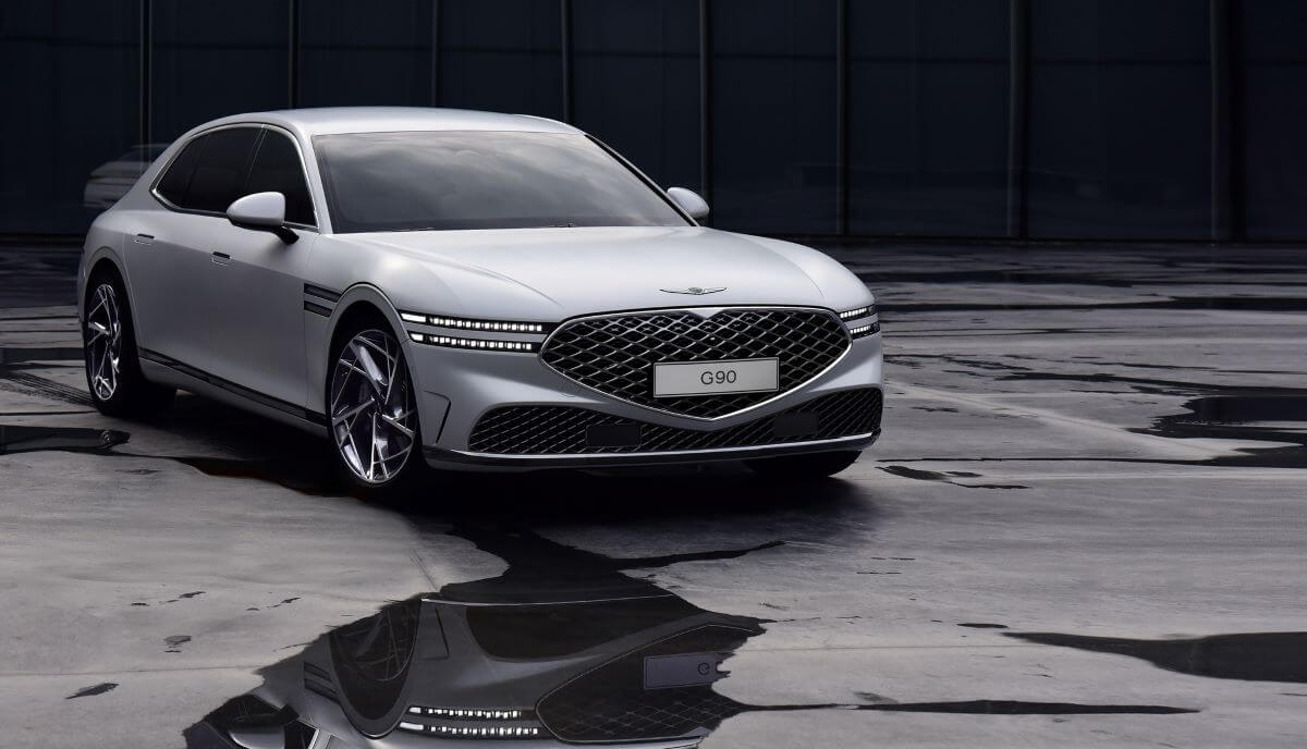 A silver-gray Genesis G90, from one of the best luxury car brands of 2023