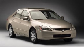 A gold 2003 Honda Accord poses for a photoshoot.