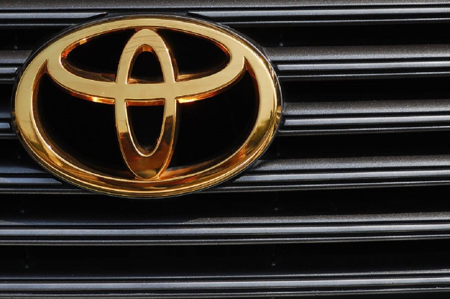 A used Toyota car shows off its problem-free gold badge on its grille.