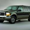 A green Ford Excursion