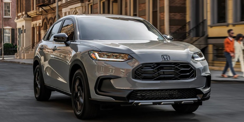 A gray 2023 Honda HR-V subcompact SUV is driving. 