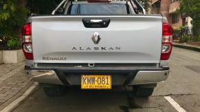 The tailgate of a Renault midsize pickup truck on the streets of Medellin Colombia, with its "Alaskan" badge visible.