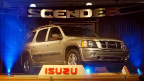 The Isuzu Ascender release event - featuring a silver SUV backlit with blue lights.