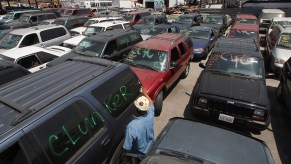 a junk yard filled with scrap cars that will never be collectible