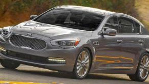 A dark-gray Kia K900 full-size luxury sedan model