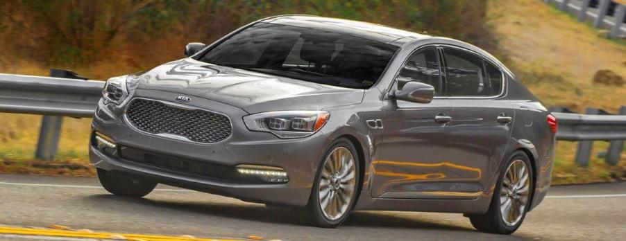 A dark-gray Kia K900 full-size luxury sedan model