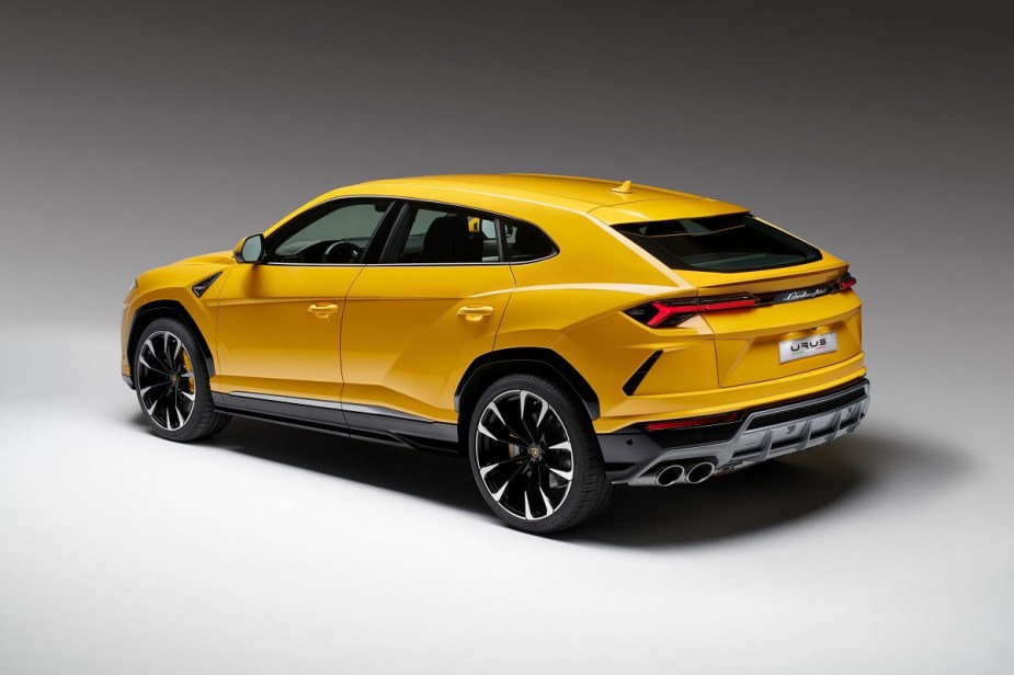 A bright yellow Lamborghini Urus shows off its SUV ride height. 