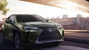 A green 2023 Lexus UX Hybrid subcompact hybrid SUV.