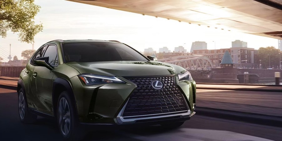 A green 2023 Lexus UX Hybrid subcompact hybrid SUV.