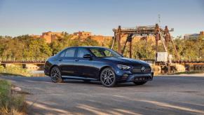 A Mercedes-Benz E 350 (E-Class) 4MATIC luxury midsize sedan/executive car model parked near a river and bridge