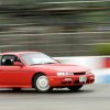 A 1998 Nissan 240SX on a racetrack