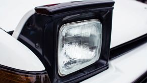 Pop-up headlights on a white car