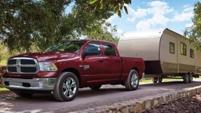 The Ram 1500 Classic tows a trailer as one of the cheapest trucks in 2023.