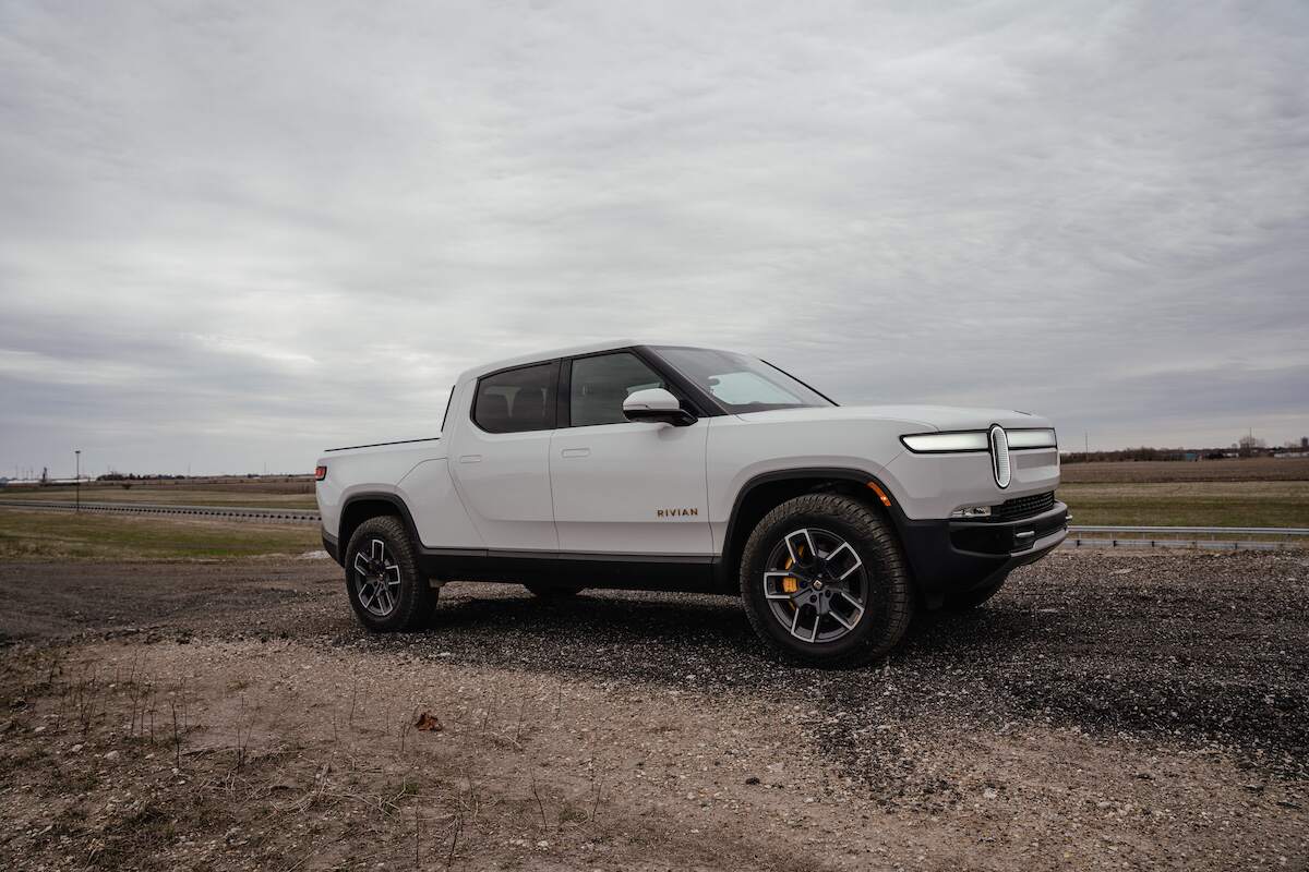 2023 pickup trucks: Rivian R1T, one of the best pickup trucks, parked in a flat desert area