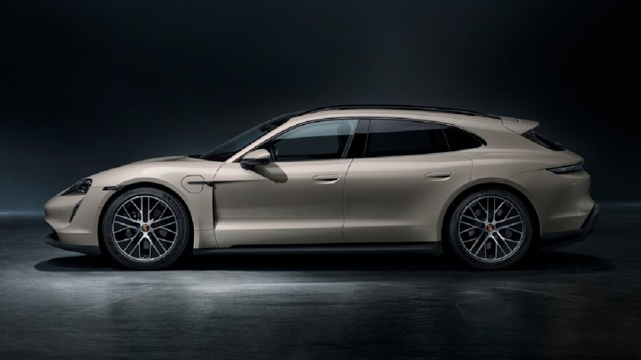 Side view of beige 2023 Porsche Taycan Sport Turismo