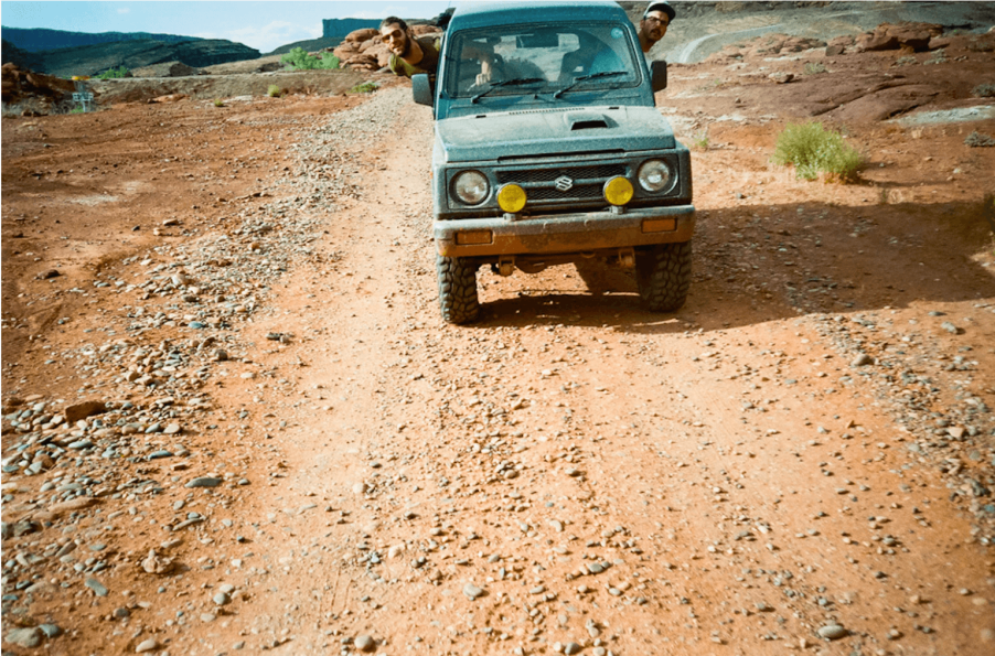 Peter Corn and Neal Thompson driving a second-gen Suzuki Jimny through Moab