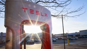 A Tesla Charging Network station with the glare from a sunset in Union City, New Jersey