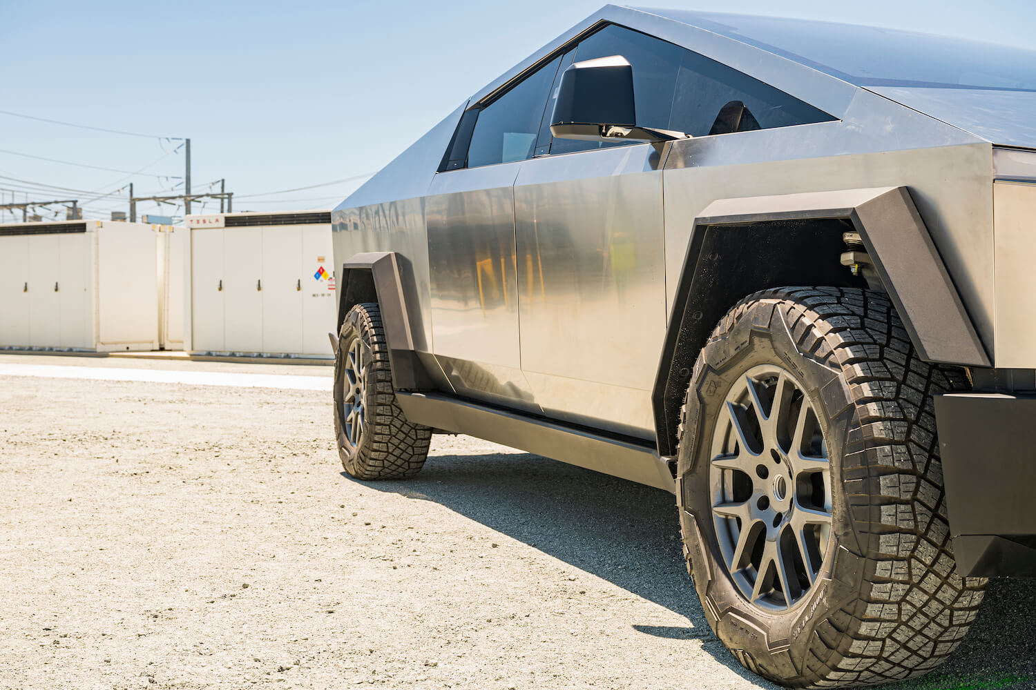 Detail shot of Tesla's new Cybertruck parked outside a factory.