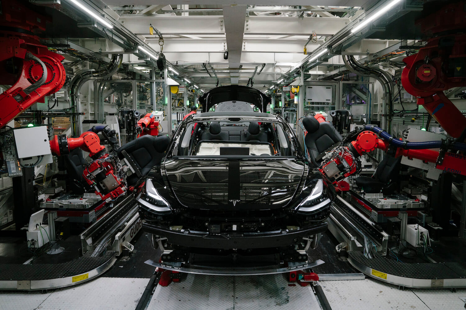 A black Tesla SUV being assembled in a plant like the factory the EV automaker is planning to build in Mexico.