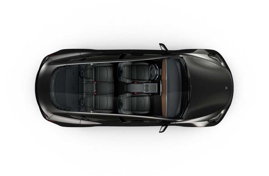 A 2023 Tesla Model 3 EV shows off its glass roof and seating for five. 