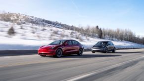 Tesla cars with top safety scores, the Model 3 and Model Y, cruise down a snowy road.