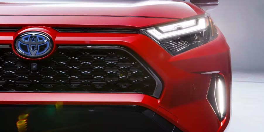 The front right side of a red 2023 Toyota RAV4 Prime, the predecessor to the new 2024 RAV4.