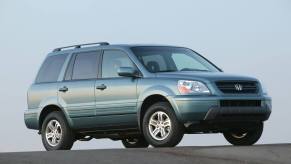 A blue-green 2005 Honda Pilot EX midsize crossover SUV model