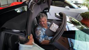 A man sells a convertible car