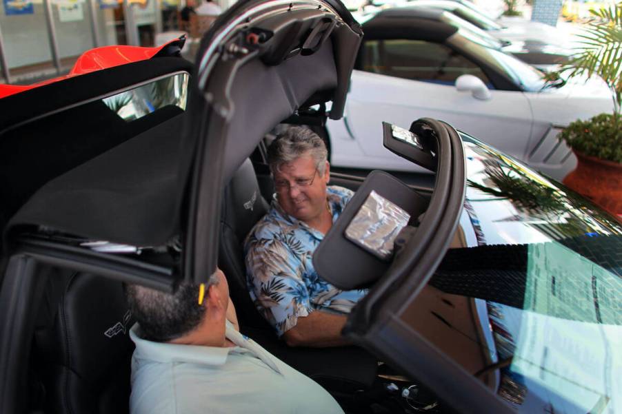 A man sells a convertible car