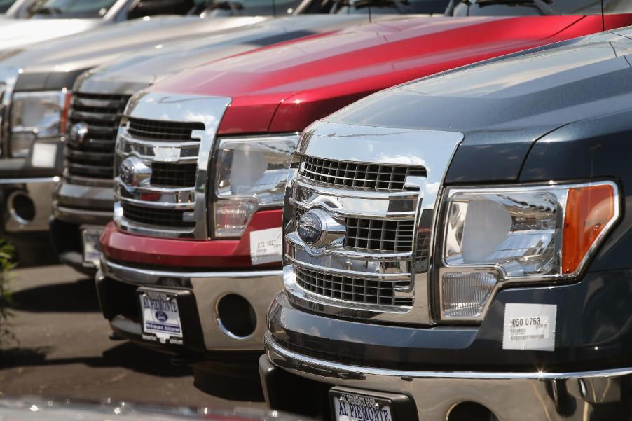 A group of 2014 Ford F-150 half-ton trucks are parked.