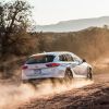 A rearview of the 2020 Buick Regal TourX driving through a desert