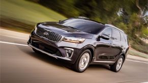 A 2020 Kia Sorento driving down the road.