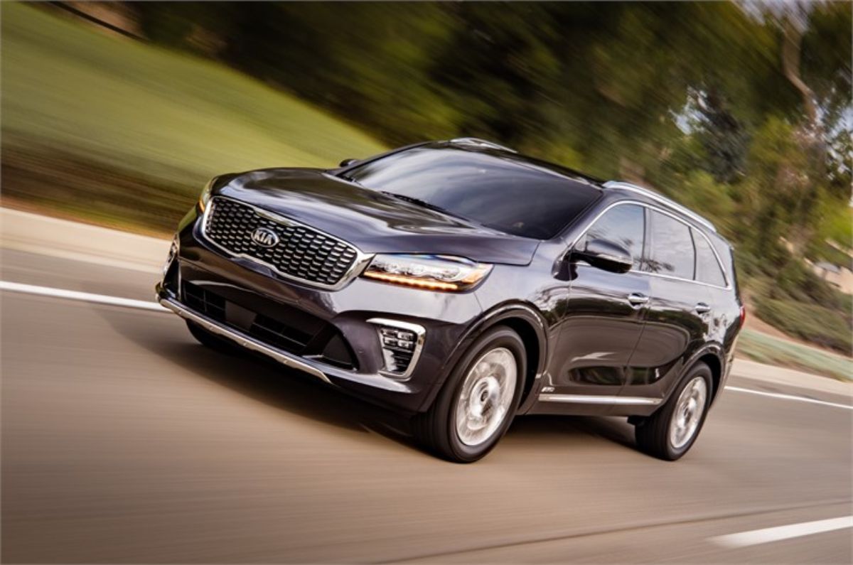 A 2020 Kia Sorento driving down the road.