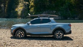 2022 Hyundai Santa Cruz parked next to a rocky shore.