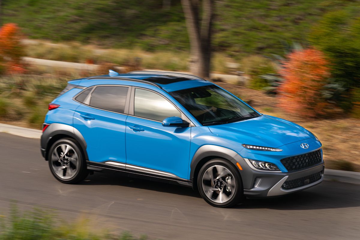 A 2022 Hyundai Kona driving down the road.