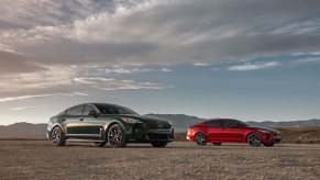 A set of 2022 Kia Stinger models pose in the desert.