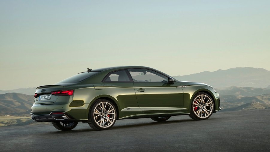 A green 2023 Audi A5 Coupe shows off its two-door body.